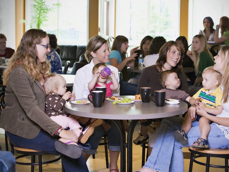 Group Of Young Mothers Relaxing In Cafe Image-45952
